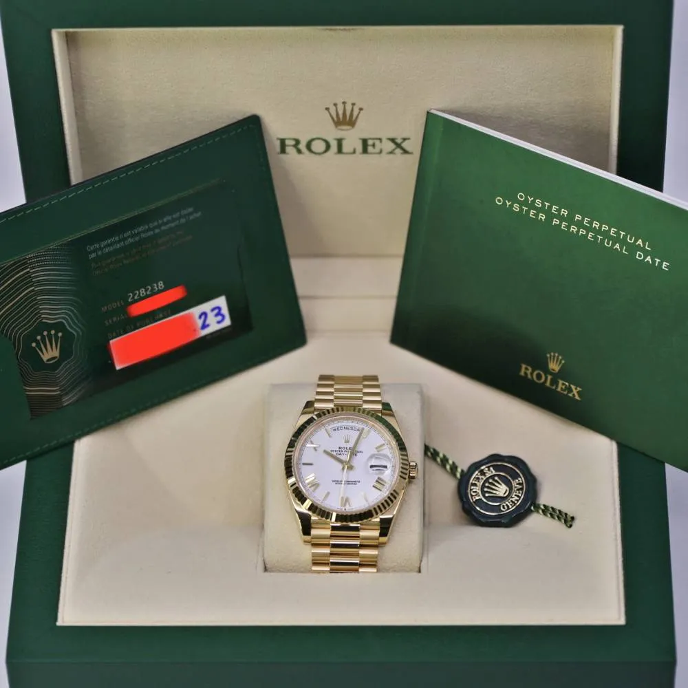 Rolex Day Date 40mm - Ref: 228238-0042 - White Roman Dial & Fluted Bezel, 18K Yellow Gold President Bracelet Men's Watch